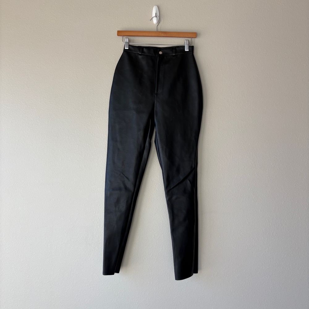 prettylittlething noir faux leather hip shaped pants